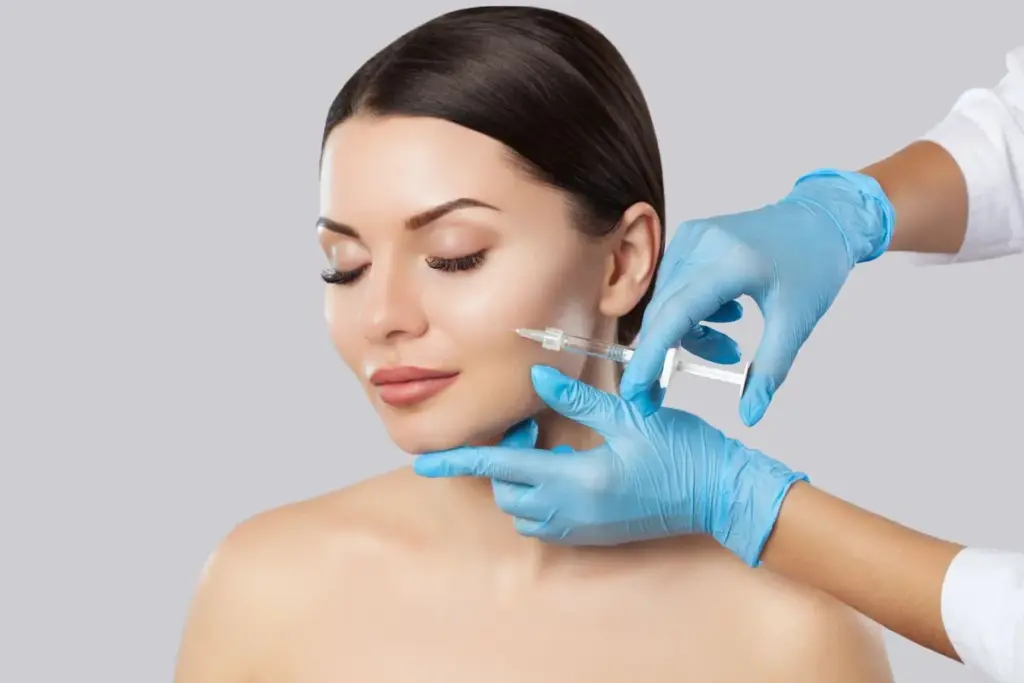 BOTOX/DYSPORT: Safe to Switch for Wrinkles? 1 Cosmetic specialist administering BOTOX or DYSPORT injection to a woman in Horseshoe Bay, TX