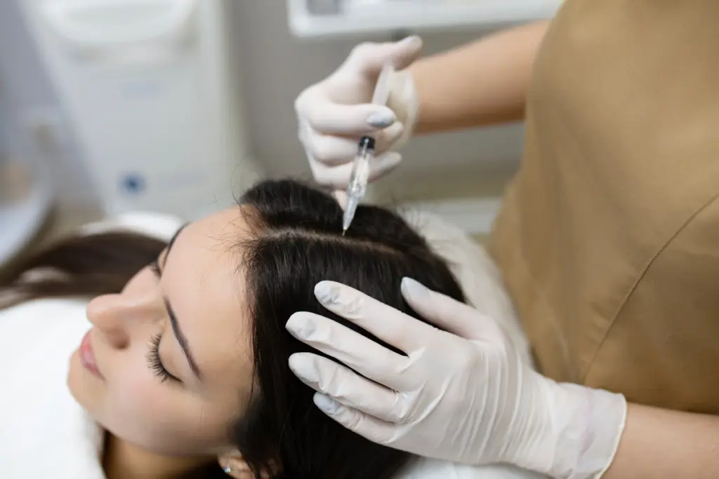 How Natural Growth Factor Injections Help With Early Hair Thinning 1 Patient Getting Natural Growth Factor Injections at Lakeside Aesthetics and Skincare